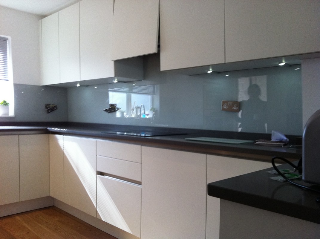 Grey glass kitchen splashback with LED lighting in Iver